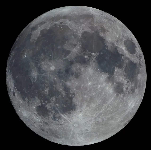 Full Moon on a black background, with grey lunar seas, bright highlands and a crater with long rays near the bottom.
